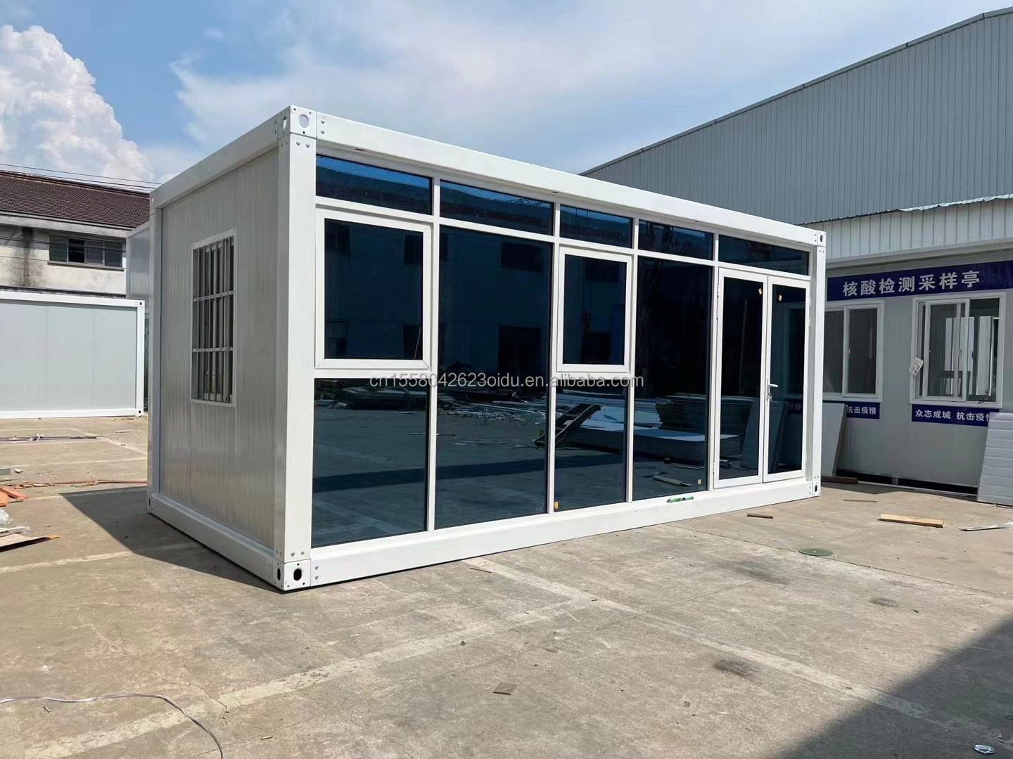 Customized Color 20ft Prefabricated Flat Package Bulk Container Frame House for Migrant Workers on Construction Site