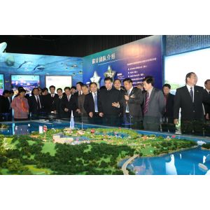 Architectural Model of Futuristic Glass Skyscraper with Illuminated Facade and