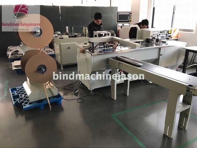 Automatic double o inserting machine with hole punching function for notebook