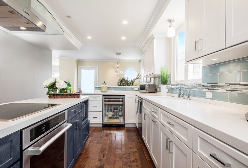 Large White Kitchen Island with Eased Edge Countertop in Modern European Design