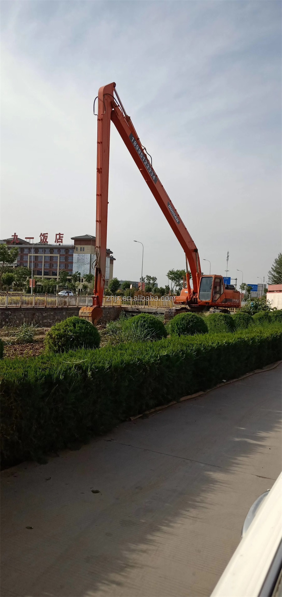 Excavator extension arm and port dredging designed for river dredging