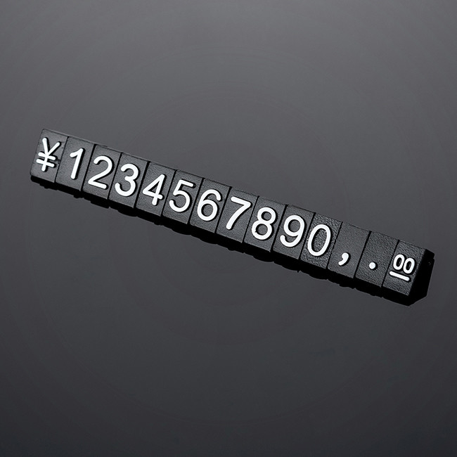 140 pcs The 5*3mm price cubes are made from black glossy plastic and have embossed white lettering
