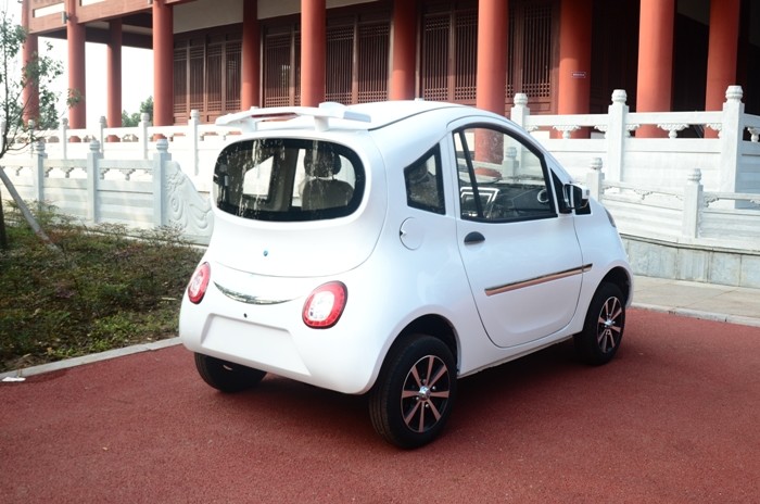 4 Wheels Drive White Body Mini Electric City Car With 2 Seats Good Climbing Ability