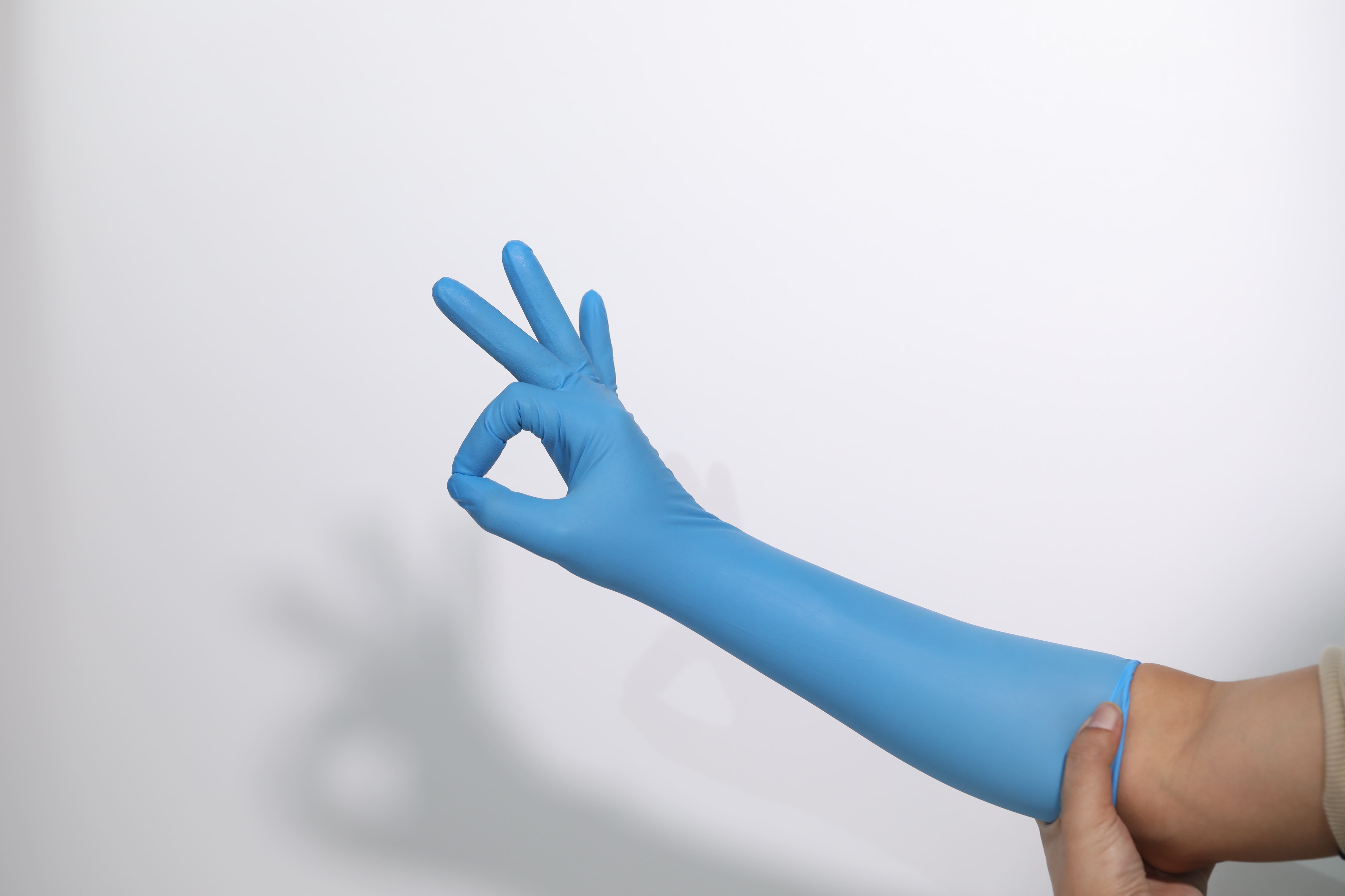 High Quality Free Samples Sky Blue Disposable Wholesale Medic Powder Free Long Sleeve Non Sterile Nitrile Gloves
