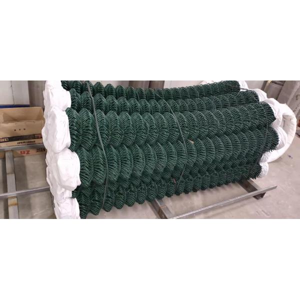 A bundle of dark green PVC coated chain link wire.