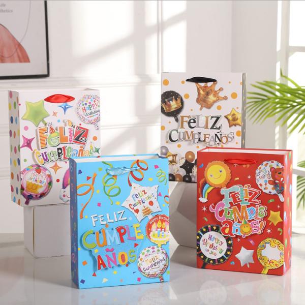 Quality 210gsm Cardboard Paper Bags Ribbon Handle For Children'S Day Party Blue Red for sale