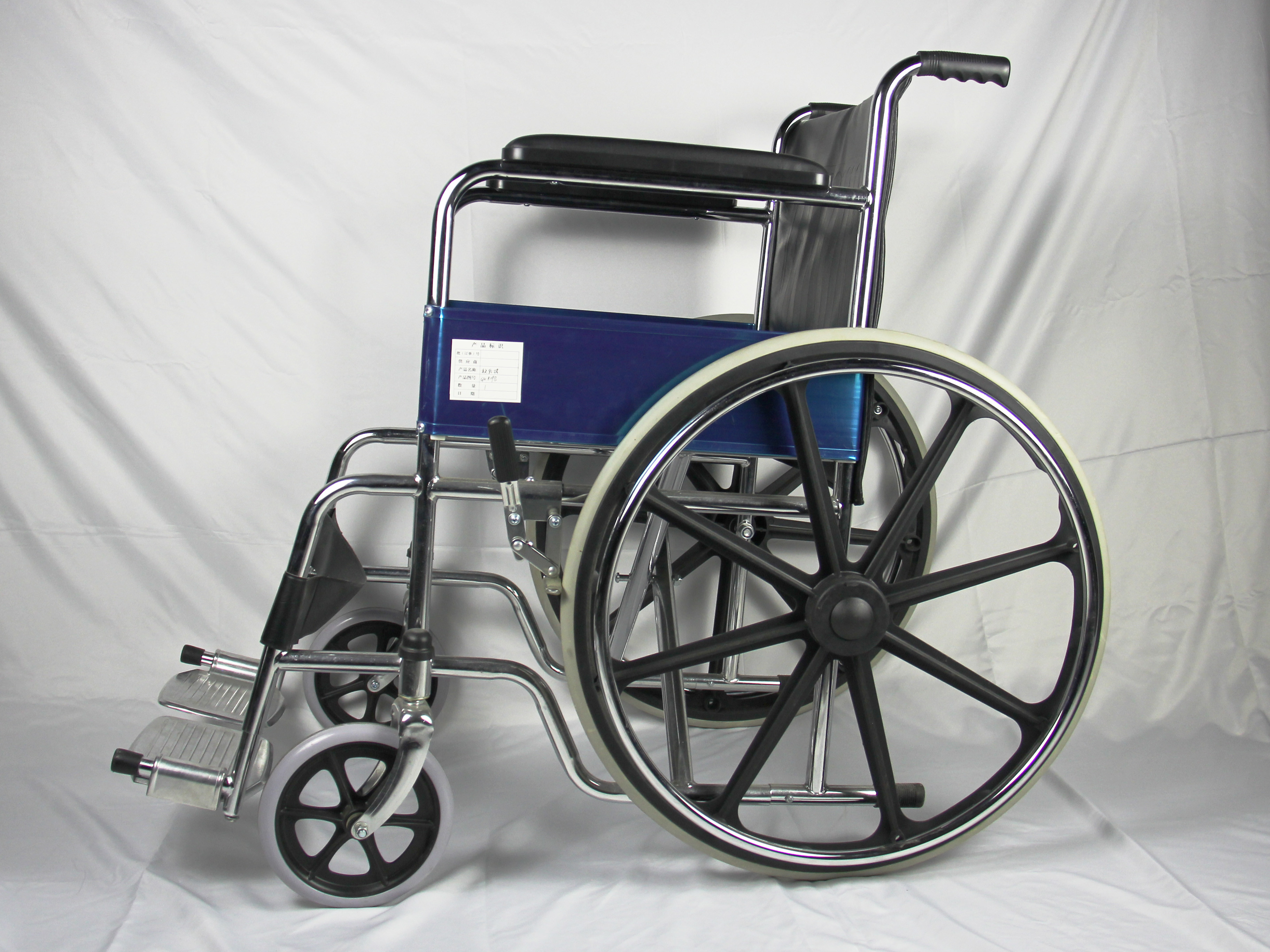 ISO Foldable Steel Wheelchair With Solid Castor Rear Wheel