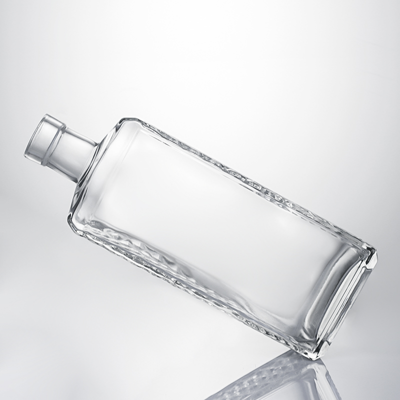 Clear Glass Liquor Bottle with Embossed Body and Cork Stopper