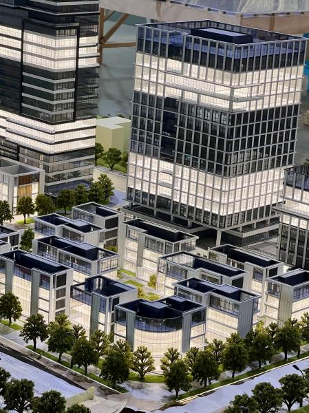 Architectural Model of Modern Urban Complex with Integrated Stadium, Business