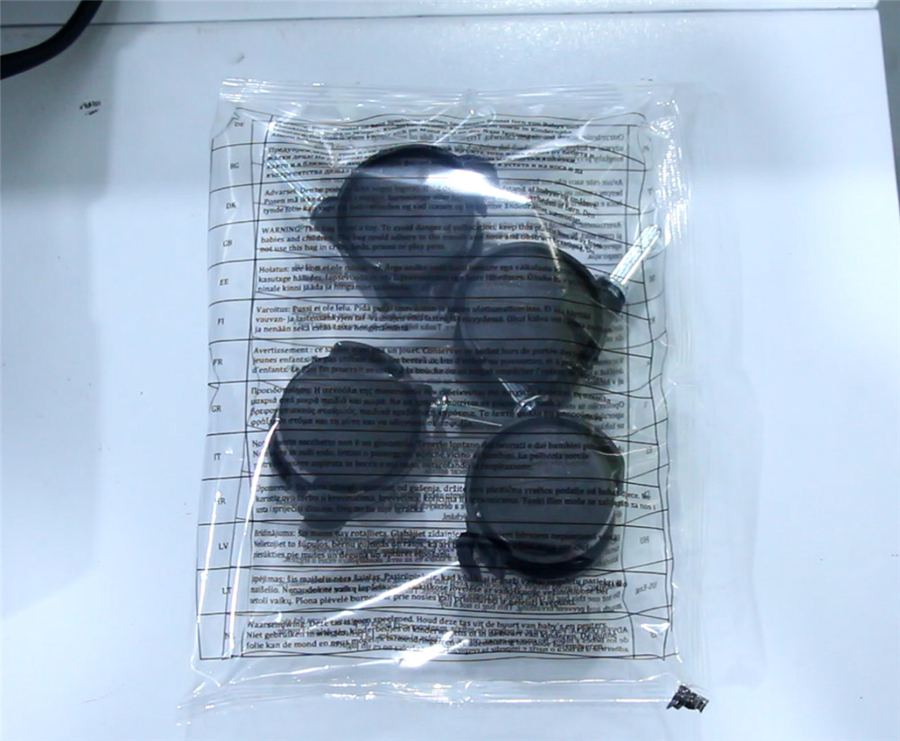 2023 Hot Sales Casters Manual Placement Sealing Bagging Packaging Machine With Printing Text Plastic Film