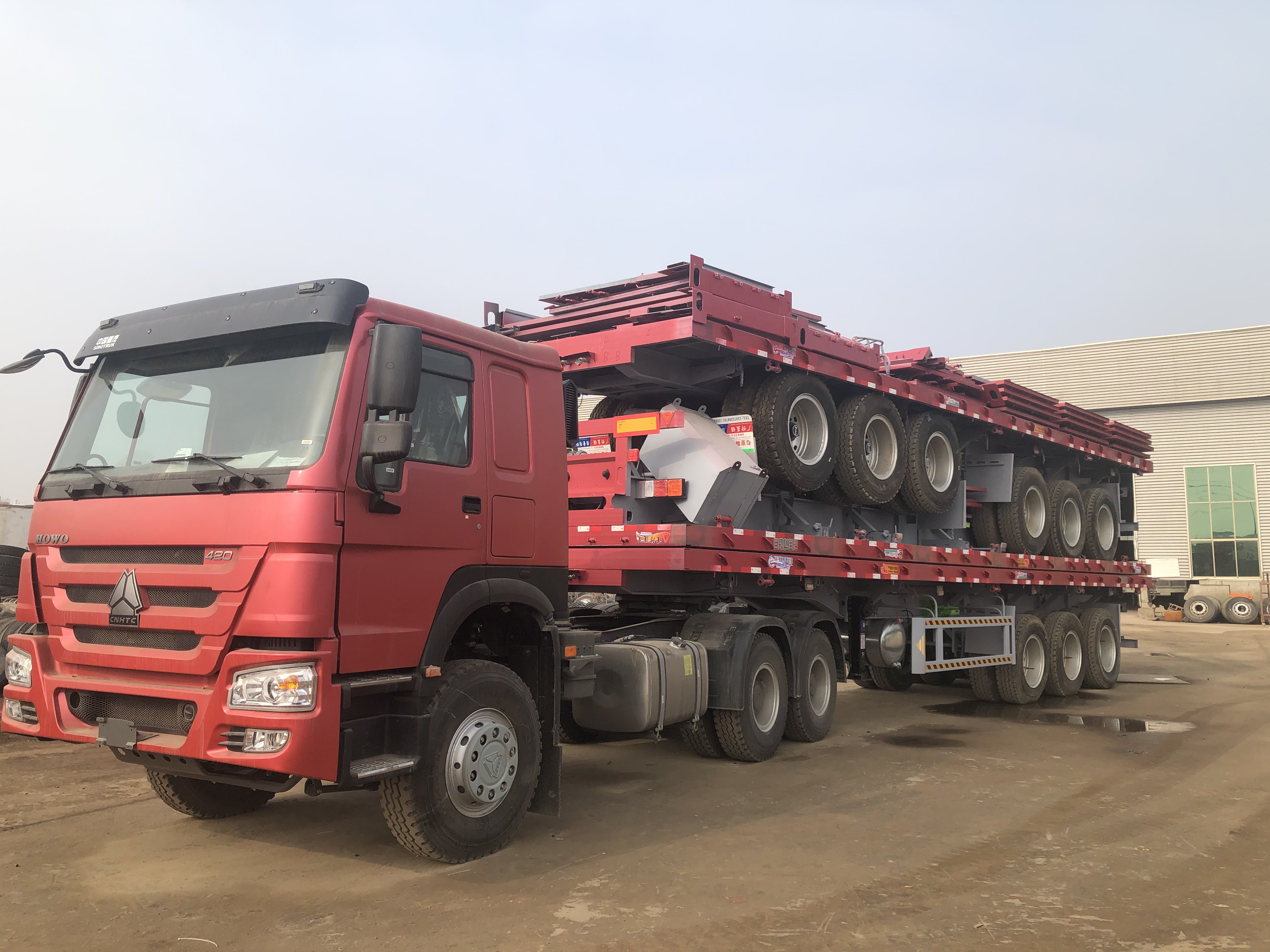 Custom 3 Axles 4 Axles 40ft 48ft 53ft 60ft Shipping Container Flatbed Semi Trailer For Rwanda And Tanzania