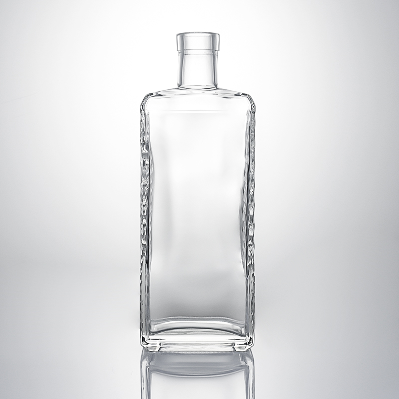 Clear Glass Liquor Bottle with Embossed Body and Cork Stopper