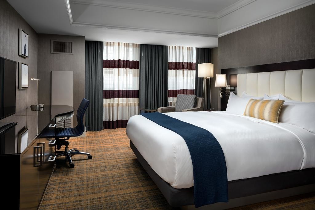 laminated Oak wood Hotel bedroom Furniture sets Tall headboard with Fabric upholstered padded and TV units Contemporary