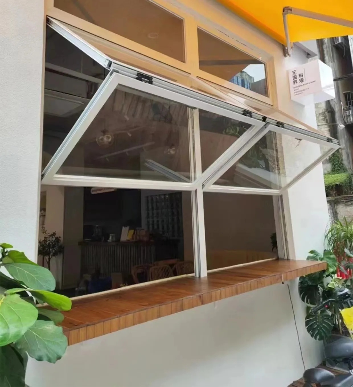 Living Micro Space Folding Window Maximizing Perception of Area in Tiny Home