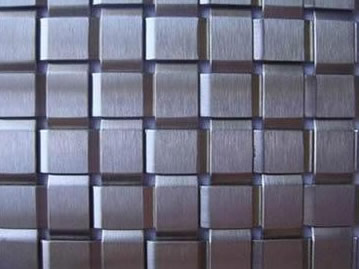 Woven wire mesh with 13mm warp pitch.