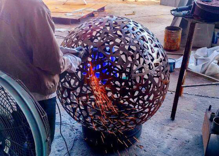 Delicate Corten Steel Carved Hollow Ball Sculpture For Garden Decoration
