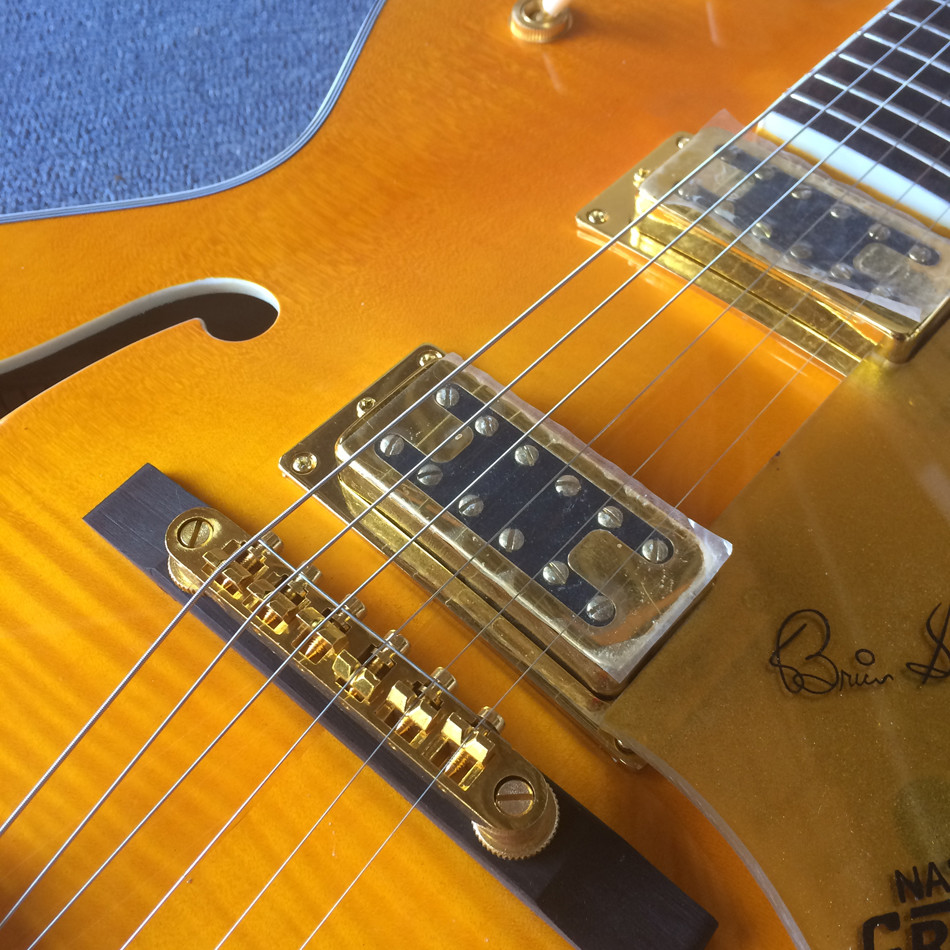 New style high-quality hollow body jazz electric guitar, Double F holes,Tremolo system ,Flame Maple top
