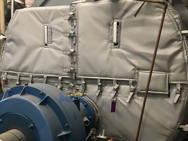 Boiler covered with small chain link fence inside for thermal insulation