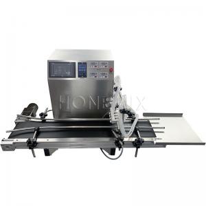  Small 4 Head Liquid Filling Machines Electric With Conveyor Belt Manufactures