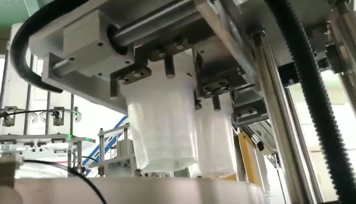 ODM Automatic Filling Machine Bottled Jars Cans Puffed Food Sweets Packing Rotary Cup Filling Sealing Machine