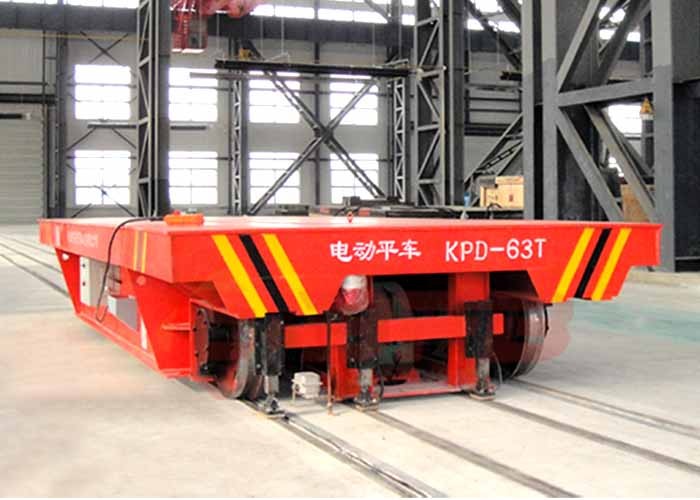 Low voltage electric rail transfer carriage for large steel structure