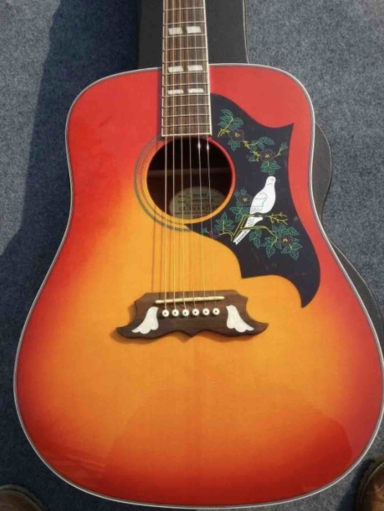 2018 Orange Sunburst Dovo acoustic guitar