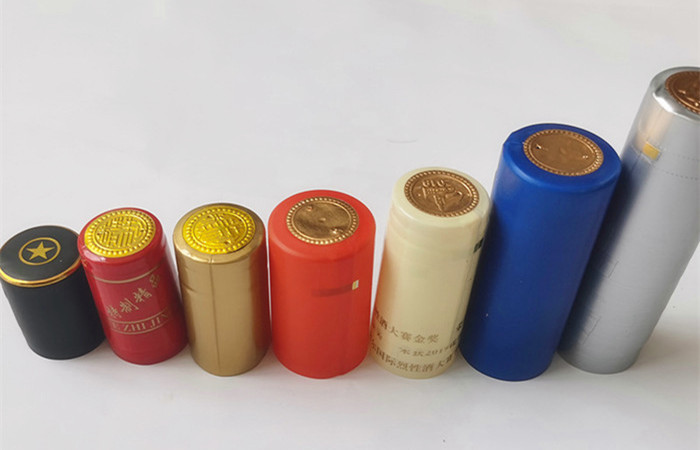Champagne Embossed Wine Bottle Shrink Caps Custom Logo Pvc Heat Shrink Capsules