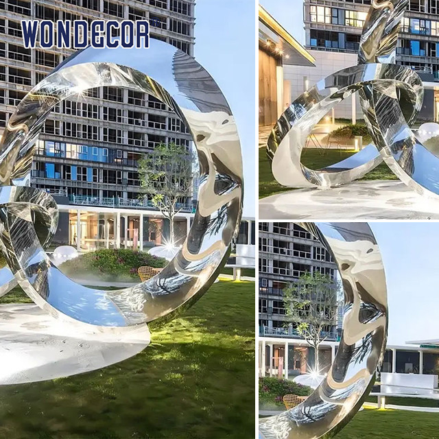 Large outdoor park shaped twisted ring stainless steel sculpture