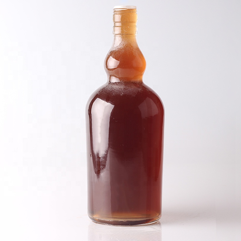 Customized Surface Handing Football Shaped Glass Bottle for Unique Alcohol Beverage