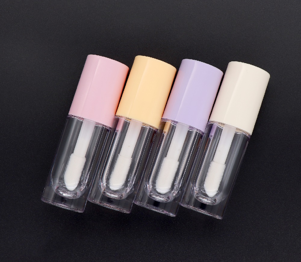 Hot sell low MOQ custom logo empty luxury round lip gloss bottle tubes with wands big brush