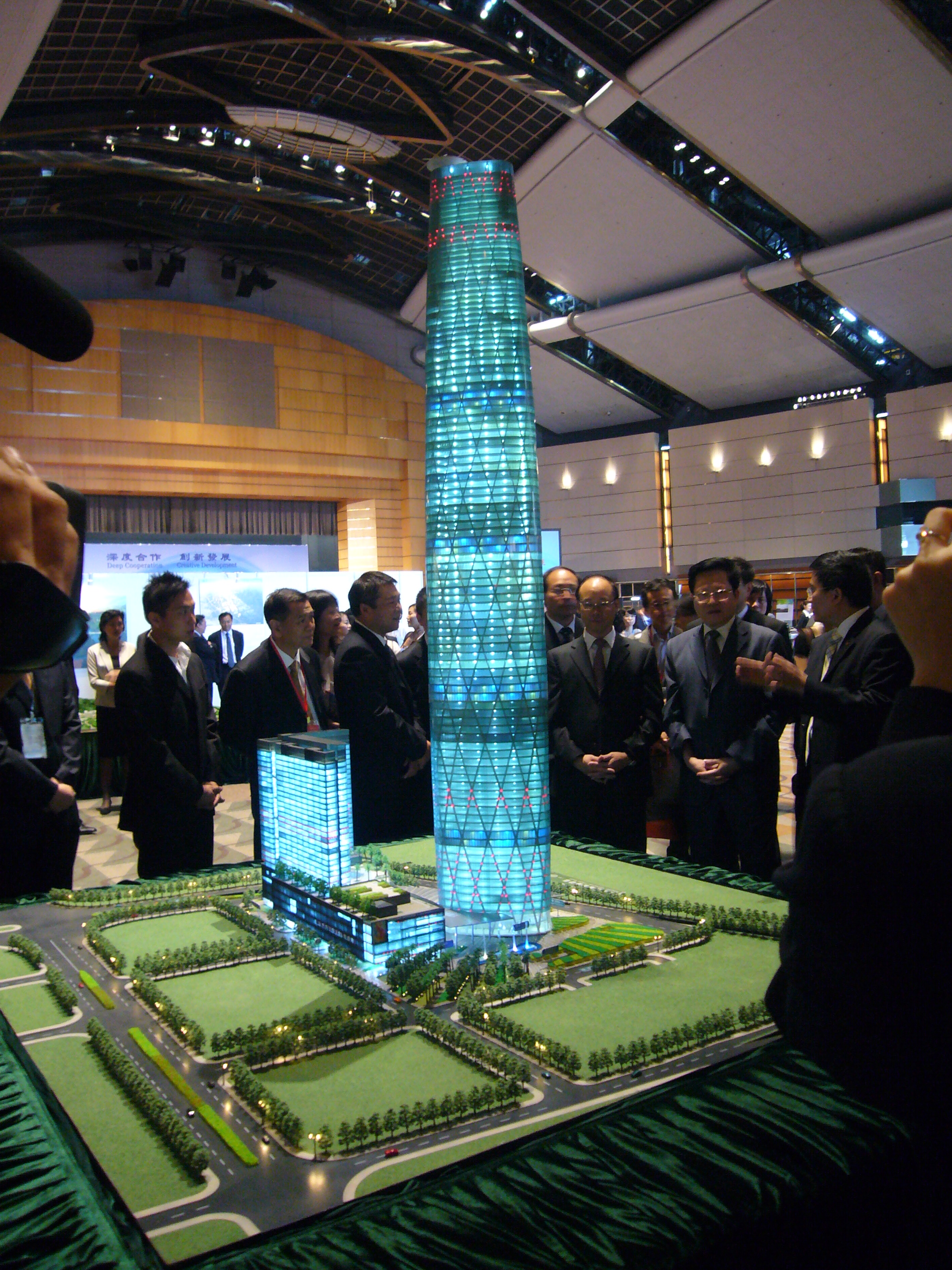 Architectural Model of Futuristic Glass Skyscraper with Illuminated Facade and