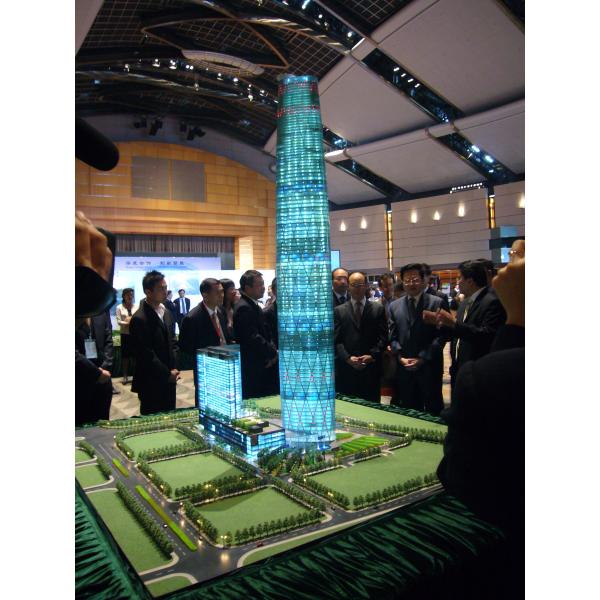Architectural Model of Futuristic Glass Skyscraper with Illuminated Facade and