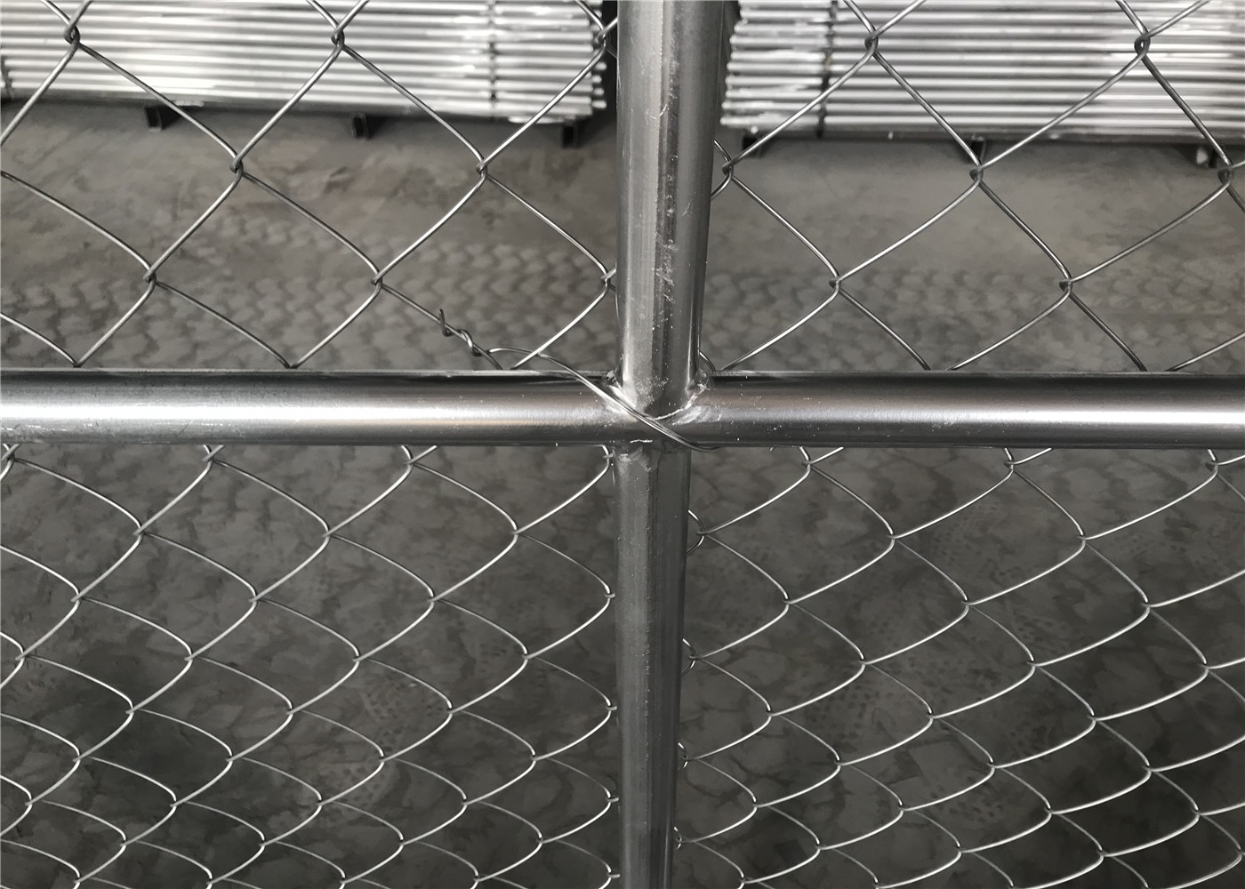 Chain wire fence protects and decorates garden and sports yard