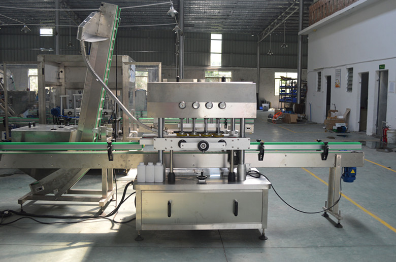 Fully automatic pneumatic linear capping machine for carbonated beverage bottles