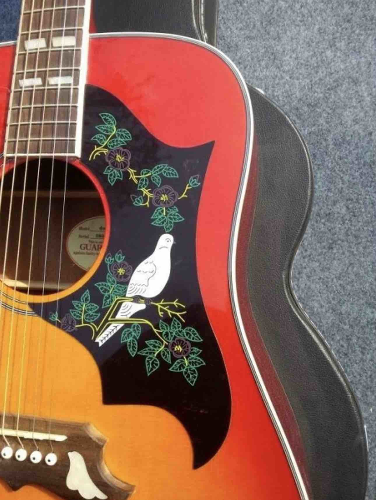 2018 Orange Sunburst Dovo acoustic guitar
