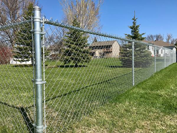 Stainless steel chain link fences are installed surrounding the residences.