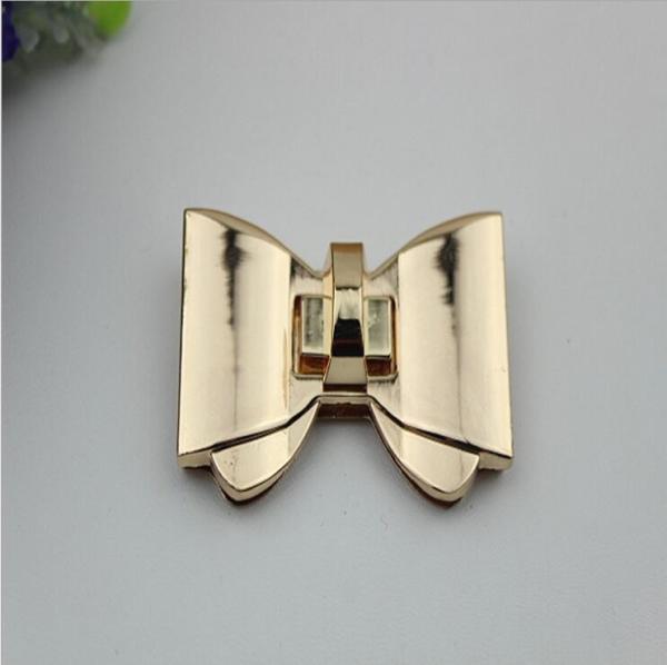 High polish gold metal bow-knot pattern zinc alloy fashion twist turn locks for