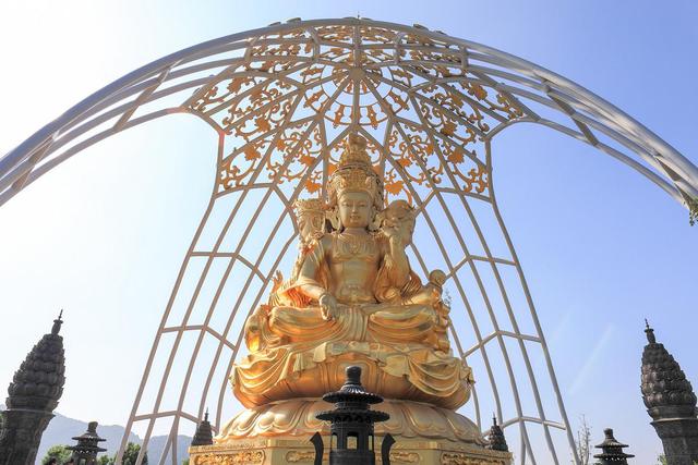 Sitting mounted  Buddha sculpture