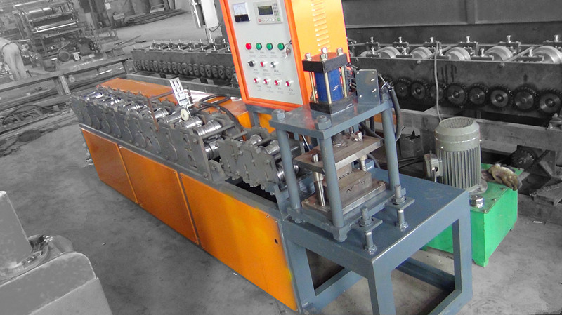dixin steel roller shutter door frame roll forming machine supplied by manufacturer