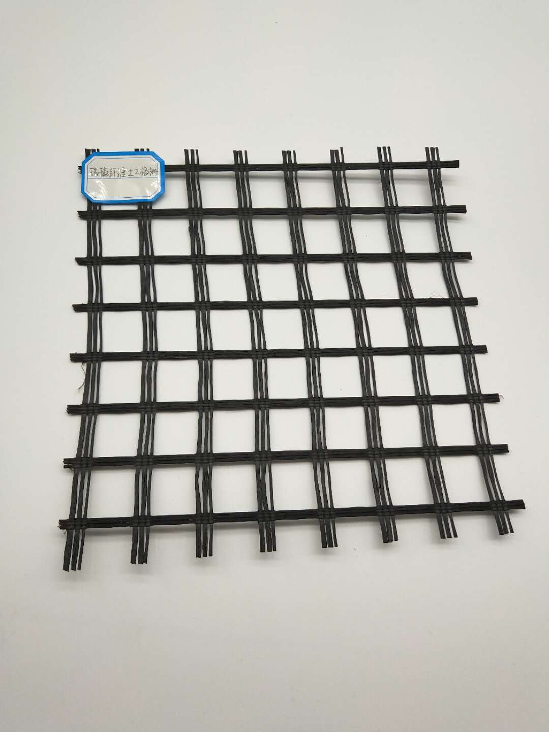 Onsite Inspection 100kn Fiberglass Geogrid Coated Bitumen for Road and Bridge Pavement