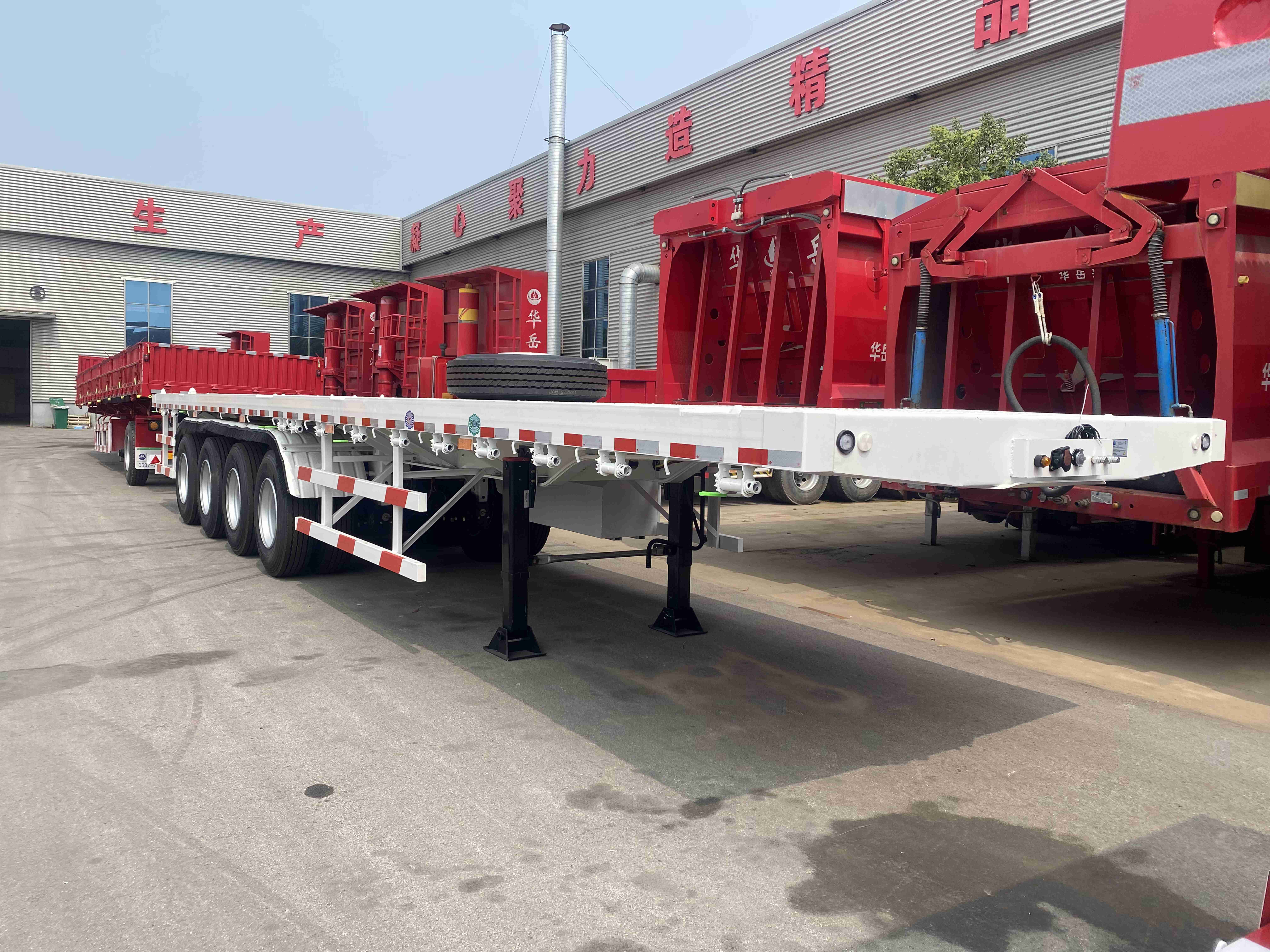 CIMC China manufacturer direct sales of 100 ton trailer, high-quality price discount 4-axis flatbed semi-trailer