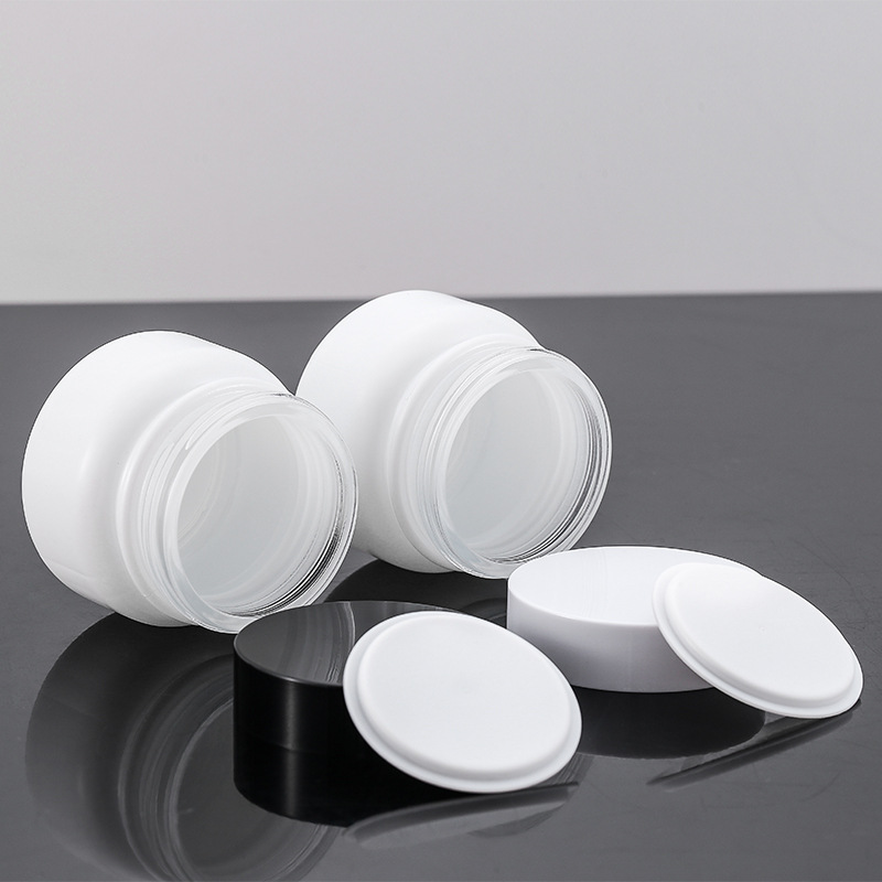 Stock Luxury Skin Care Glass Jar 50g Empty Frosted Cosmetic Packaging with Black Lid and Glass Bottle Plastic Cap White Disc