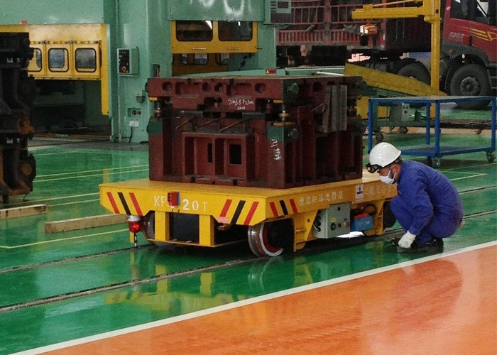 Concrete factory floor flatbed rail car with turning system
