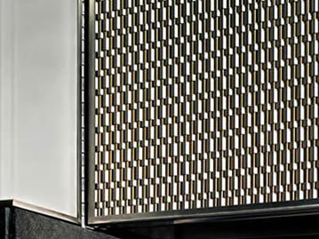 Stainless steel and brass type flat wire woven mesh is installed on the facade of building.