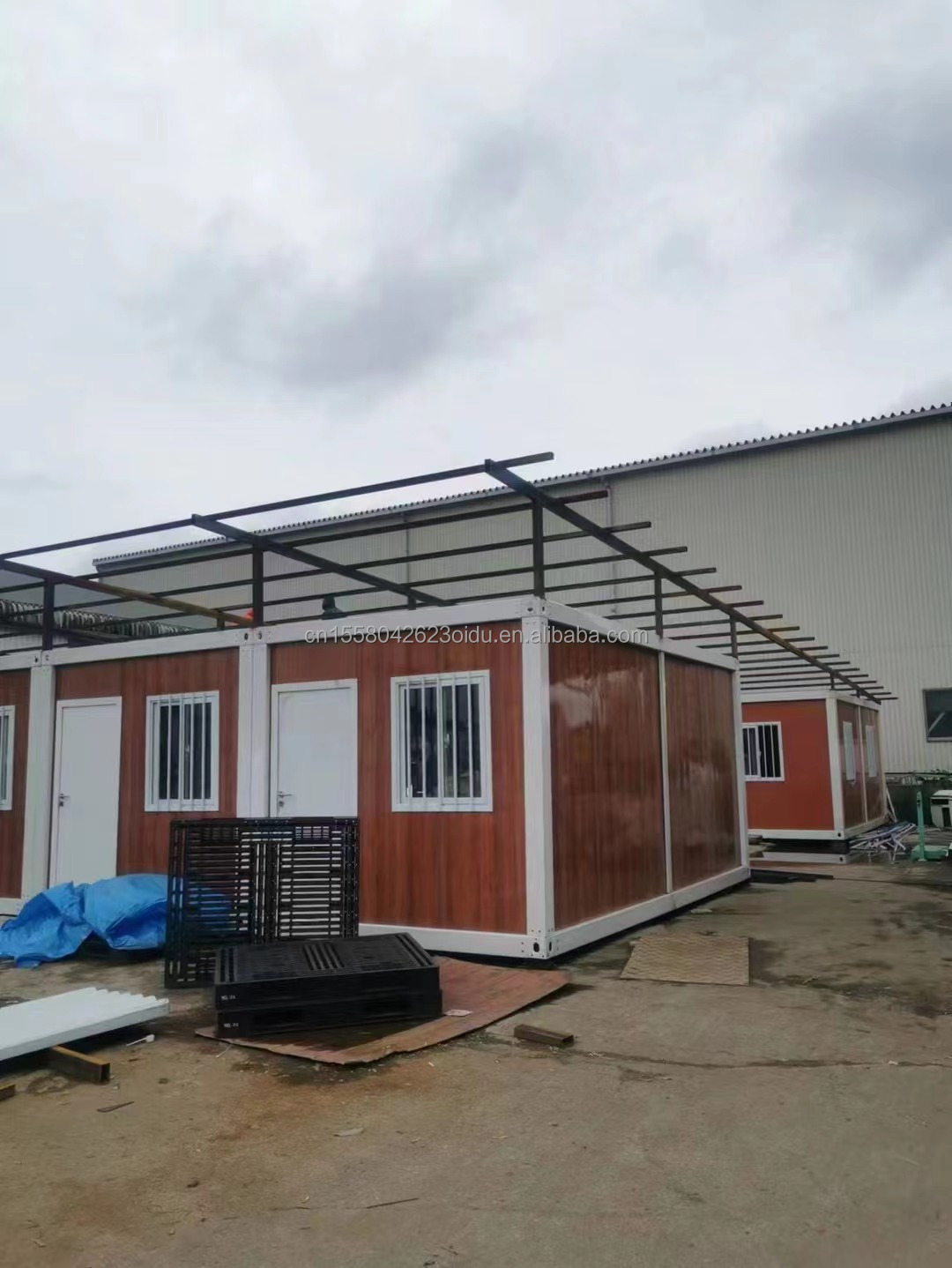 Customized Color 20ft Prefabricated Flat Package Bulk Container Frame House for Migrant Workers on Construction Site