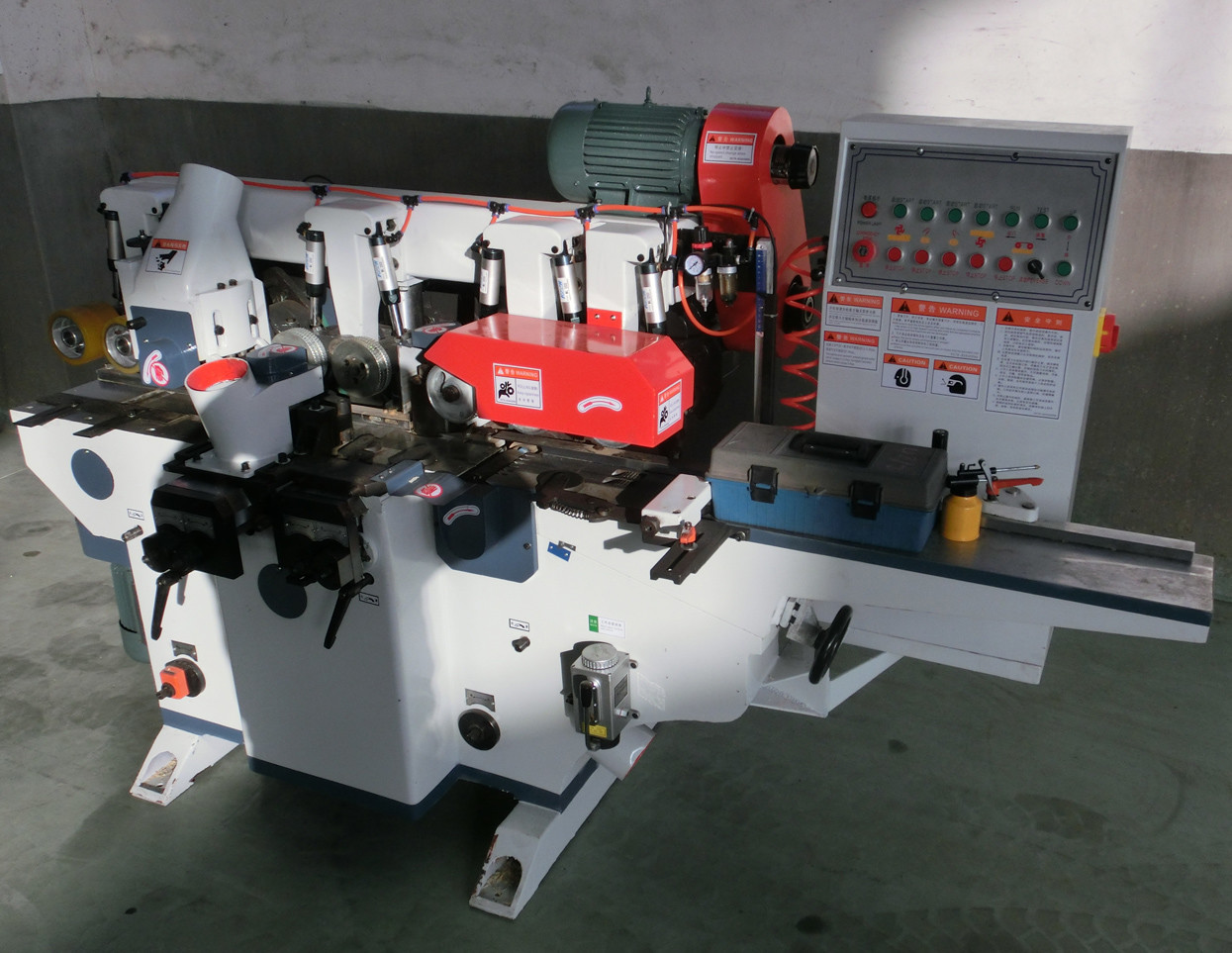 Four sided picture frame moulding machine