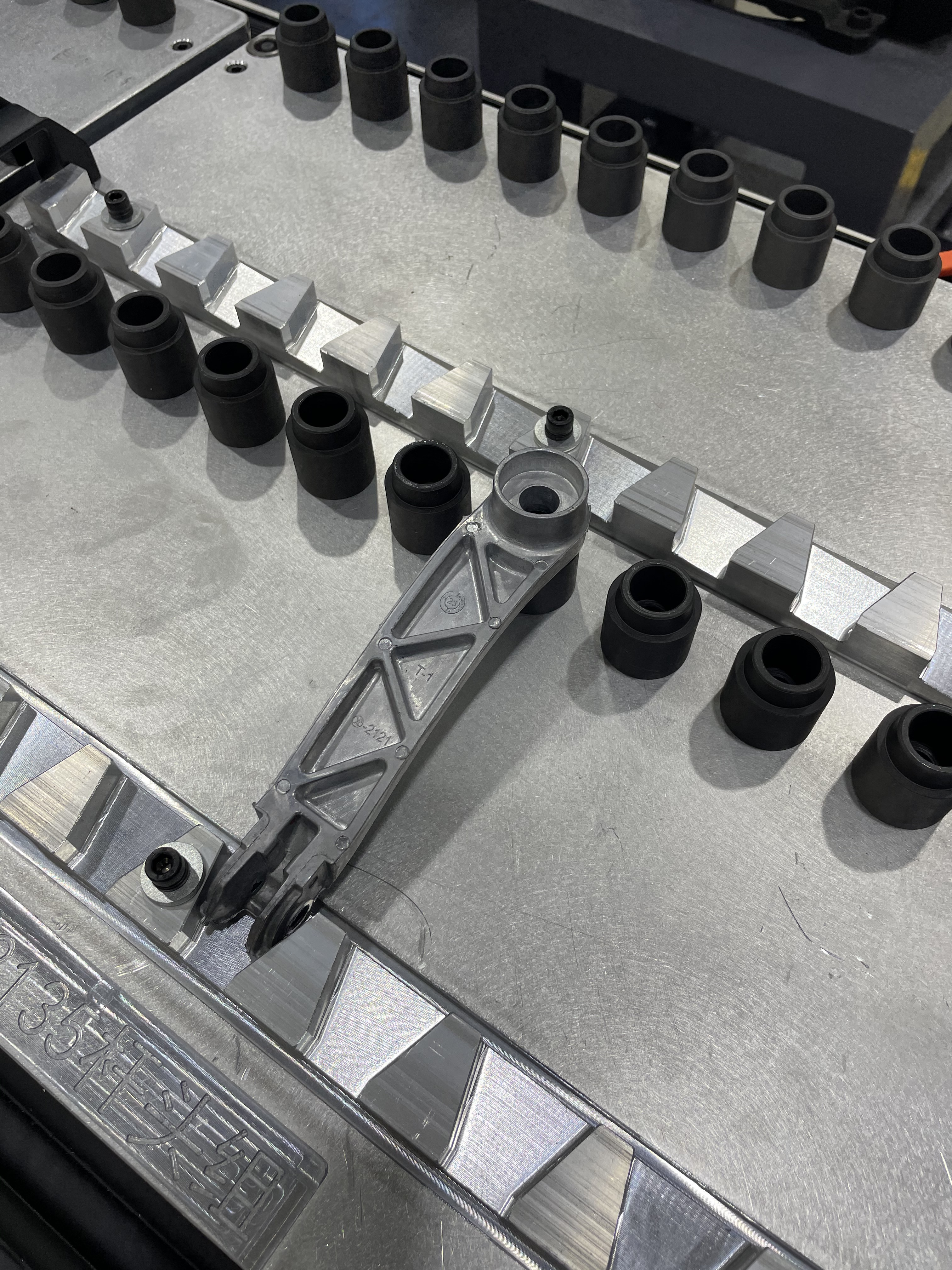 Close-up view of robotic polishing machine finishing bathroom hardware